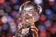 INDIANAPOLIS, IN - FEBRUARY 05: Members of the New York Giants pose with the Vince Lombardi Trophy after the Giants defeated the Patriots by a score of 21-17 in Super Bowl XLVI at Lucas Oil Stadium on February 5, 2012 in Indianapolis, Indiana. (Photo by Ezra Shaw/Getty Images)