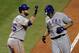 ST LOUIS, MO - OCTOBER 27: Nelson Cruz #17 (R) of the Texas Rangers celebrates with Mike Napoli #25 after hitting a solo home run in the seventh inning during Game Six of the MLB World Series against the St. Louis Cardinals at Busch Stadium on October 27, 2011 in St Louis, Missouri. (Photo by Doug Pensinger/Getty Images)