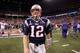A dejected Tom Brady walks off the field in Indianapolis last night following the loss.