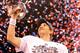 INDIANAPOLIS, IN - FEBRUARY 05: Quarterback Eli Manning #10 of the New York Giants poses with the Vince Lombardi Trophy after the Giants defeated the Patriots by a score of 21-17 in Super Bowl XLVI at Lucas Oil Stadium on February 5, 2012 in Indianapolis, Indiana. (Photo by Ezra Shaw/Getty Images)