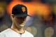 PHOENIX, AZ - SEPTEMBER 23: Starting pitcher Matt Cain #18 of the San Francisco Giants walks back to the dugout during the Major League Baseball game against the Arizona Diamondbacks at Chase Field on September 23, 2011 in Phoenix, Arizona. (Photo by Christian Petersen/Getty Images)