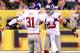 INDIANAPOLIS, IN - FEBRUARY 05: Corner Backs Aaron Ross #31 and Corey Webster #23 of the New York Giants celebrate after quarterback Tom Brady #12 of the New England Patriots threw an intentional grounding that caused a safety in the first quarter against the New York Giants during Super Bowl XLVI at Lucas Oil Stadium on February 5, 2012 in Indianapolis, Indiana. (Photo by Andy Lyons/Getty Images)