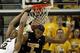 COLUMBIA, MO - DECEMBER 15: Steve Moore #32 of the Missouri Tigers backward dunks as Markeith Cummings #2 of the Kennesaw State Owls defends during the game on December 15, 2011 at Mizzou Arena in Columbia, Missouri. (Photo by Jamie Squire/Getty Images)