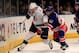 NEW YORK, NY - DECEMBER 08: (L) Vincent Lecavalier #4 of the Tampa Bay Lightning battles with (R) Steve Eminger #44 of the New York Rangers for the puck at Madison Square Garden on December 8, 2011 in New York City. (Photo by Chris Trotman/Getty Images)