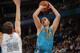 DENVER, CO - JANUARY 09: Chris Kaman #35 of the New Orleans Hornets takes a shot over Timofey Mozgov #25 of the Denver Nuggets at the Pepsi Center on January 9, 2012 in Denver, Colorado. The Hornets defeated the Nuggets 94-81. NOTE TO USER: User expressly acknowledges and agrees that, by downloading and or using this photograph, User is consenting to the terms and conditions of the Getty Images License Agreement. (Photo by Doug Pensinger/Getty Images)