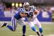 INDIANAPOLIS, IN - NOVEMBER 27: Jeremy Shockey#80 of the Carolina Panthers runs with the ball while defended by Philip Wheeler #50 of the Indianapolis Colts during the game at Lucas Oil Stadium on November 27, 2011 in Indianapolis, Indiana. (Photo by Andy Lyons/Getty Images)
