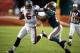 Tampa Bay Quarterback Josh Freeman fending off Crowder