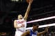 NEWARK, NJ - FEBRUARY 11: Manu Ginobili #20 of the San Antonio Spurs drives for a shot attempt in the first half against Shawne Williams #7 of the New Jersey Nets at Prudential Center on February 11, 2012 in Newark, New Jersey. NOTE TO USER: User expressly acknowledges and agrees that, by downloading and or using this photograph, User is consenting to the terms and conditions of the Getty Images License Agreement. (Photo by Chris Chambers/Getty Images)