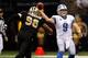 NEW ORLEANS, LA - DECEMBER 04: Quarterback Matthew Stafford #9 of the Detroit Lions looks to pass as he is rushed by defensive tackle Tom Johnson #96 of the New Orleans Saints at Mercedes-Benz Superdome on December 4, 2011 in New Orleans, Louisiana. (Photo by Chris Graythen/Getty Images)