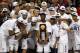 HOUSTON, TX - APRIL 04: Kemba Walker #15 of the Connecticut Huskies holds the trophy as he and his team celebrate after defeating the Butler Bulldogs to win the National Championship Game of the 2011 NCAA Division I Men's Basketball Tournament by a score of 53-41 at Reliant Stadium on April 4, 2011 in Houston, Texas. (Photo by Andy Lyons/Getty Images)