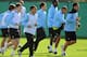 MANCHESTER, ENGLAND - SEPTEMBER 26: Adam Johnson (L), Carlos Tevez (2nd L) and Manchester City team-mates warm up during a training session ahead of their UEFA Champions League Group A match against Bayern Munich on September 26, 2011 in Manchester, United Kingdom. (Photo by Michael Regan/Getty Images)