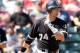 TEMPE, AZ - MARCH 12: Josh Kroeger #74 of the Chicago White Sox hits a RBI triple against the Los Angeles Angels of Anaheim during the second inning of the MLB spring training game at Tempe Diablo Stadium on March 12, 2010 in Tempe, Arizona. (Photo by Christian Petersen/Getty Images)