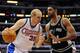 LOS ANGELES, CA - DECEMBER 13: Chris Kaman #35 of the Los Angeles Clippers dribbles to the basket in front of Tim Duncan #21 of the San Antonio Spurs at Staples Center on December 13, 2009 in Los Angeles, California. NOTE TO USER: User expressly acknowledges and agrees that, by downloading and/or using this Photograph, user is consenting to the terms and conditions of the Getty Images License Agreement. (Photo by Harry How/Getty Images)