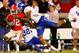 ATHENS, GA - NOVEMBER 21: Tavarres King #12 of the Georgia Bulldogs is tackled by Trevard Lindley #32 and Winston Guy Jr. #21 of the Kentucky Wildcats at Sanford Stadium on November 21, 2009 in Athens, Georgia. (Photo by Kevin C. Cox/Getty Images)