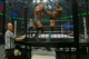 Punk kicks Jericho's head into the Chamber wall.