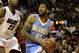 MIAMI, FL - MARCH 19: Forward Wilson Chandler #21 of the Denver Nuggets drives against Center Erick Dampier #25 of the Miami Heat at American Airlines Arena on March 19, 2011 in Miami, Florida. The Heat defeated the Nuggets 103-98. NOTE TO USER: User expressly acknowledges and agrees that, by downloading and/or using this Photograph, User is consenting to the terms and conditions of the Getty Images License Agreement. (Photo by Marc Serota/Getty Images)