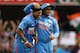 BRISBANE, AUSTRALIA - FEBRUARY 21: Umesh Yadav of India celebrates with team mate Virender Sehwag after taking the wicket of Kumar Sangakkara of Sri Lanka during game eight of the One Day International Series between India and Sri Lanka at The Gabba on February 21, 2012 in Brisbane, Australia. (Photo by Bradley Kanaris/Getty Images)