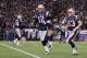 FOXBORO, MA - JANUARY 14: (L-R) Tom Brady #12 and Wes Welker #83 of the New England Patriots run to the sideline after Welker caught a 7-yard touchdown reception from Brady in the first quarter against the Denver Broncos during their AFC Divisional Playoff Game at Gillette Stadium on January 14, 2012 in Foxboro, Massachusetts. (Photo by Elsa/Getty Images)