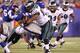 EAST RUTHERFORD, NJ - NOVEMBER 20: D.J. Ware #28 of the New York Giants is hit by Cullen Jenkins #97 of the Philadelphia Eagles in the second quarter at MetLife Stadium on November 20, 2011 in East Rutherford, New Jersey. (Photo by Al Bello/Getty Images)