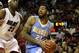 MIAMI, FL - MARCH 19: Forward Wilson Chandler #21 of the Denver Nuggets drives against Center Erick Dampier #25 of the Miami Heat at American Airlines Arena on March 19, 2011 in Miami, Florida. The Heat defeated the Nuggets 103-98. NOTE TO USER: User expressly acknowledges and agrees that, by downloading and/or using this Photograph, User is consenting to the terms and conditions of the Getty Images License Agreement. (Photo by Marc Serota/Getty Images)
