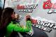 DAYTONA BEACH, FL - FEBRUARY 24: Danica Patrick, driver of the #7 GoDaddy.com Chevrolet, signs the Coors Light Pole Award board after qualifying for the pole position for the NASCAR Nationwide Series DRIVE4COPD 300 at Daytona International Speedway on February 24, 2012 in Daytona Beach, Florida. (Photo by Tom Pennington/Getty Images for NASCAR)