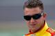 DAYTONA BEACH, FL - FEBRUARY 19: A.J. Allmendinger, driver of the #22 Shell/Pennzoil Dodge, looks on during qualifying for the NASCAR Sprint Cup Series Daytona 500 at Daytona International Speedway on February 19, 2012 in Daytona Beach, Florida. (Photo by Todd Warshaw/Getty Images for NASCAR)