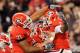 ATHENS, GA - NOVEMBER 27: Cordy Glenn #71 and Ben Jones #61 of the Georgia Bulldogs celebrate with Orson Charles #7 after Charles touchdown against the Georgia Tech Yellow Jackets at Sanford Stadium on November 27, 2010 in Athens, Georgia. (Photo by Kevin C. Cox/Getty Images)