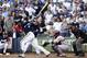 MILWAUKEE, WI - OCTOBER 09: Ryan Braun #8 of the Milwaukee Brewers hits a 2-RBI ground rule double in the bottom of the fifth inning against the St. Louis Cardinals during Game one of the National League Championship Series at Miller Park on October 9, 2011 in Milwaukee, Wisconsin. (Photo by Christian Petersen/Getty Images)