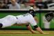 NEW YORK, NY - OCTOBER 06: Brett Gardner #11 of the New York Yankees slides safely back into first base on a pickoff attempt against Miguel Cabrera #24 of the Detroit Tigers during Game Five of the American League Championship Series at Yankee Stadium on October 6, 2011 in the Bronx borough of New York City. (Photo by Patrick McDermott/Getty Images)