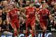LIVERPOOL, ENGLAND - JANUARY 25: Steven Gerrard of Liverpool celebrates scoring his team's first goal from a penalty with Jordan Henderson and Dirk Kuyt (R) during the Carling Cup Semi Final Second Leg match between Liverpool and Manchester City at Anfield on January 25, 2012 in Liverpool, England. (Photo by Michael Regan/Getty Images)