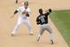 OAKLAND, CA - MAY 15: Omar Vizquel #11 of the Chicago White Sox throws around Landon Powell #11 of the Oakland Athletics to try to get a double play in the seventh inning at Oakland-Alameda County Coliseum on May 15, 2011 in Oakland, California. Powell scored later in the inning. (Photo by Ezra Shaw/Getty Images)