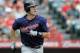 ANAHEIM, CA - SEPTEMBER 04: Joe Mauer #7 of the Minnesota Twins watches his solo homerun for a 1-1 tie against the Los Angeles Angels of Anaheim during the fourth inning at Angel Stadium of Anaheim on September 4, 2011 in Anaheim, California. (Photo by Harry How/Getty Images)