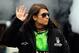 DAYTONA BEACH, FL - FEBRUARY 26: Danica Patrick, driver of the #10 GoDaddy.com Chevrolet, waves to fans during driver introductions prior to the start of the NASCAR Sprint Cup Series Daytona 500 at Daytona International Speedway on February 26, 2012 in Daytona Beach, Florida. (Photo by Streeter Lecka/Getty Images)