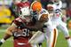 GLENDALE, AZ - DECEMBER 18: D'Qwell Jackson #52 of the Cleveland Browns tackles Todd Heap #86 of the Arizona Cardinals at University of Phoenix Stadium on December 18, 2011 in Glendale, Arizona. Arizona won 20-17. (Photo by Norm Hall/Getty Images)