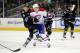 Montreal Canadien's Alexei Emelin delivers a check on San Jose Shark's Joe Pavelski.