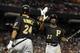 PHOENIX, AZ - SEPTEMBER 20: Andrew McCutchen #22 of the Pittsburgh Pirates high fives Pedro Alvarez #24 after scoring agianst the Arizona Diamondbacks during the fifth inning of the Major League Baseball game at Chase Field on September 20, 2011 in Phoenix, Arizona. (Photo by Christian Petersen/Getty Images)