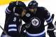 Wheeler and Kane having fun after Wheeler scored a goal where Kane tried to get a hat trick late in the third period.