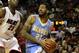 MIAMI, FL - MARCH 19: Forward Wilson Chandler #21 of the Denver Nuggets drives against Center Erick Dampier #25 of the Miami Heat at American Airlines Arena on March 19, 2011 in Miami, Florida. The Heat defeated the Nuggets 103-98. NOTE TO USER: User expressly acknowledges and agrees that, by downloading and/or using this Photograph, User is consenting to the terms and conditions of the Getty Images License Agreement. (Photo by Marc Serota/Getty Images)