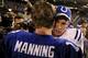 EAST RUTHERFORD, NJ - SEPTEMBER 10: Quarterback Eli Manning #10 of the New York Giants (L) congratulates his brother quarterback Peyton Manning #18 of the Indianapolis Colts on his 26-21 victory on September 10, 2006 at Giants Stadium in East Rutherford, New Jersey. (Photo by Travis Lindquist/Getty Images)