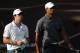 ABU DHABI, UNITED ARAB EMIRATES - JANUARY 28: Rory McIlroy of Northern Ireland and Tiger Woods of the USA during the third round of Abu Dhabi HSBC Golf Championship at the Abu Dhabi HSBC Golf Championship on January 28, 2012 in Abu Dhabi, United Arab Emirates. (Photo by Ross Kinnaird/Getty Images)
