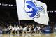 NEWARK, NJ - DECEMBER 02: Cheerleaders for the Seton Hall Pirates perform with a giant school flag during a time out against the Auburn Tigers at Prudential Center on December 2, 2011 in Newark, New Jersey. (Photo by Chris Chambers/Getty Images)