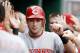 PITTSBURGH, PA - SEPTEMBER 25: Paul Janish #7 of the Cincinnati Reds is congratulated by teammates in the dugout after scoring against the Pittsburgh Pirates in the 6th inning during the game on September 25, 2011 at PNC Park in Pittsburgh, Pennsylvania. (Photo by Jared Wickerham/Getty Images)