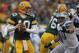 GREEN BAY, WI - JANUARY 01: Matt Flynn #10 of the Green Bay Packerslooks for a receiver as Ndamukong Suh #90 of the Detroit Lions rushes at Lambeau Field on January 1, 2012 in Green Bay, Wisconsin. The Packers defeated the Lions 45-41. (Photo by Jonathan Daniel/Getty Images)