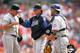 WASHINGTON ? APRIL 13: Pitching coach Rick Peterson #51 and catcher Ramon Castro #11 of the New York Mets talk with their pitcher Victor Zambrano #38 during the game against the Washington Nationals on April 13, 2006 at RFK Stadium in Washington, DC. The Mets won 13-4. (Photo by Jamie Squire/Getty Images)