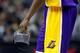 WASHINGTON, DC - MARCH 07: Kobe Bryant #24 of the Los Angeles Lakers holds his face mask during the second of the Lakers loss to the Washington Wizards at the Verizon Center on March 7, 2012 in Washington, DC. NOTE TO USER: User expressly acknowledges and agrees that, by downloading and or using this photograph, User is consenting to the terms and conditions of the Getty Images License Agreement. (Photo by Rob Carr/Getty Images)