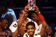 ORLANDO, FL - FEBRUARY 24: Kyrie Irving #2 of the Cleveland Cavaliers and Team Chuck holds up his MVP award during the BBVA Rising Stars Challenge part of the 2012 NBA All-Star Weekend at Amway Center on February 24, 2012 in Orlando, Florida. NOTE TO USER: User expressly acknowledges and agrees that, by downloading and or using this photograph, User is consenting to the terms and conditions of the Getty Images License Agreement. (Photo by Ronald Martinez/Getty Images)
