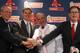 BOSTON, MA - DECEMBER 01: Team owners Larry Lucchino, left, and John Henry, far right, and vice president and general manager Ben Cherington, center, pose with Bobby Valentine after he was introduced as the new manager for the Boston Red Sox during a press conference on December 1, 2011 at Fenway Park in Boston, Massachusetts. (Photo by Elsa/Getty Images)