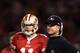 SAN FRANCISCO, CA - JANUARY 22: Alex Smith #11 of the San Francisco 49ers stands with head coach Jim Harbaugh of the San Francisco 49ers
during the fourth quarter of the NFC Championship Game against the New York Giants at Candlestick Park on January 22, 2012 in San Francisco, California. (Photo by Ezra Shaw/Getty Images)