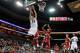 LOUISVILLE, KY - DECEMBER 23: Kyle Kuric #14 of the Louisville Cardinals shoots the ball while defended by Kahlil McDonald #3 of the Western Kentucky Hilltoppers during the game at KFC YUM! Center on December 23, 2011 in Louisville, Kentucky. Louisville won 70-60. (Photo by Andy Lyons/Getty Images)