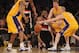 LOS ANGELES, CA - FEBRUARY 20: Raymond Felton #5 of the Portland Trail Blazers loses the ball as he falls in front of Steve Blake #5 and Troy Murphy #14 of the Los Angeles Lakers during the first half at Staples Center on February 20, 2012 in Los Angeles, California. NOTE TO USER: User expressly acknowledges and agrees that, by downloading and or using this photograph, User is consenting to the terms and conditions of the Getty Images License Agreement. (Photo by Harry How/Getty Images)